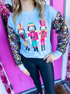 Blue sequin sleeve nutcracker French Terry top